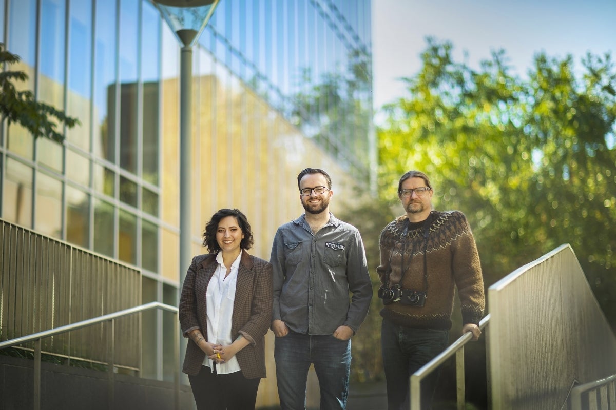 Photo of Gressitt-Diaz, Cooper, and Cassidy standing together outside 