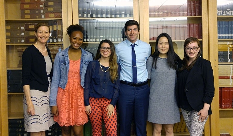 Honors thesis students pose for photo with thesis advisor