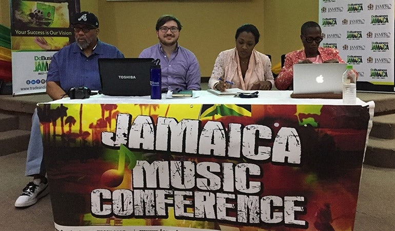 John Vilanova at table at Jamaica Music Conference