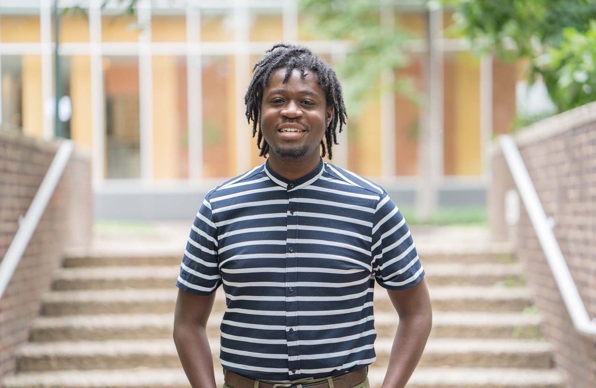 Portrait of Darin Johnson standing in front of Annenberg Public Policy Center