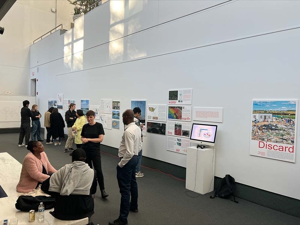 People mingling at an exhibition in the Annenberg Forum