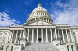 Front view of the US Capitol on a sunny day, photo credit  Louis Velazquez / Unsplash 