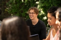 Tom Etienne pictured outdoors during a meeting.