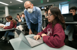 Matt O'Donnell talks to a student in his class