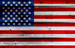 American flag painted on a disressed wooden fence