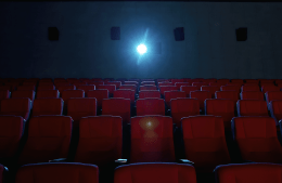 Empty movie theater with red seats