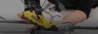 Woman holding an underwater research device