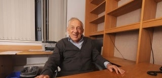 Elihu Katz seated behind a desk