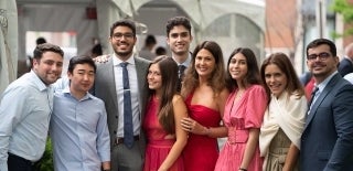 Group of people standing together posing for a photo