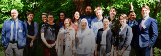 Group of people standing together posing for a photo