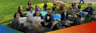 CN Lab members seated outdoors for a picnic