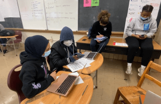 Students in a classroom working on computers