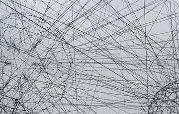 Photo of an abstract connected network. Photo credit: Alina Grubnyak / Unsplash