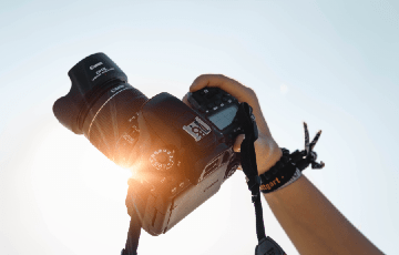 Photo of a camera. Photo credit: Christian Wiediger / Unsplash