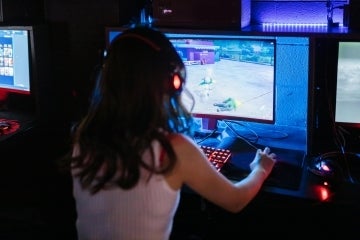 women playing game on a computer