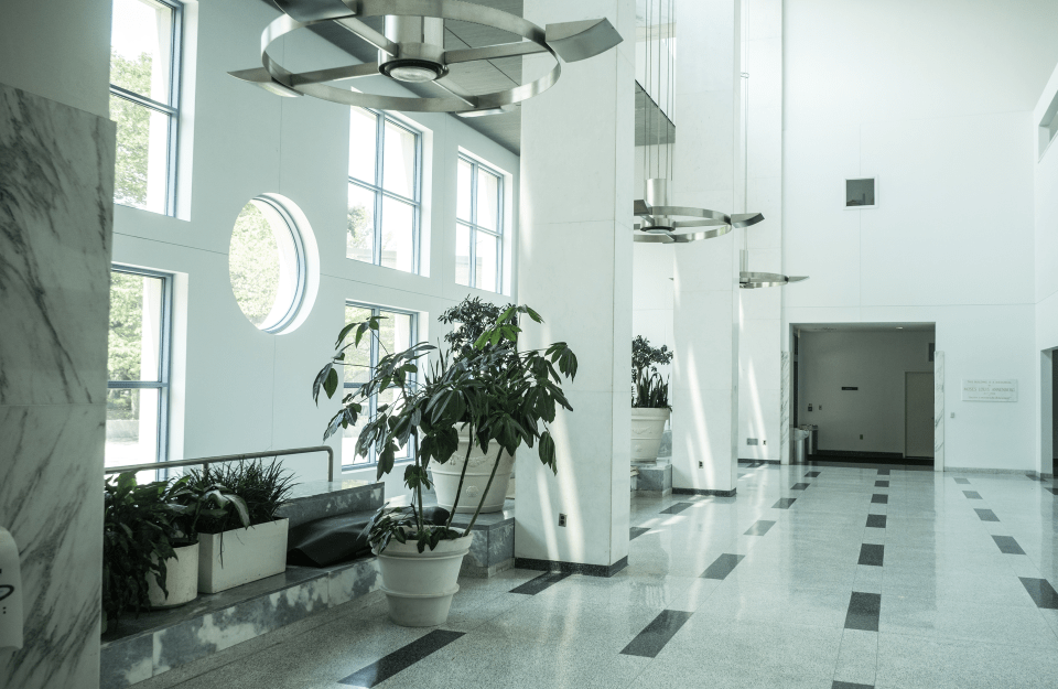 a side view of a white room inside Annenberg building with modern decoration