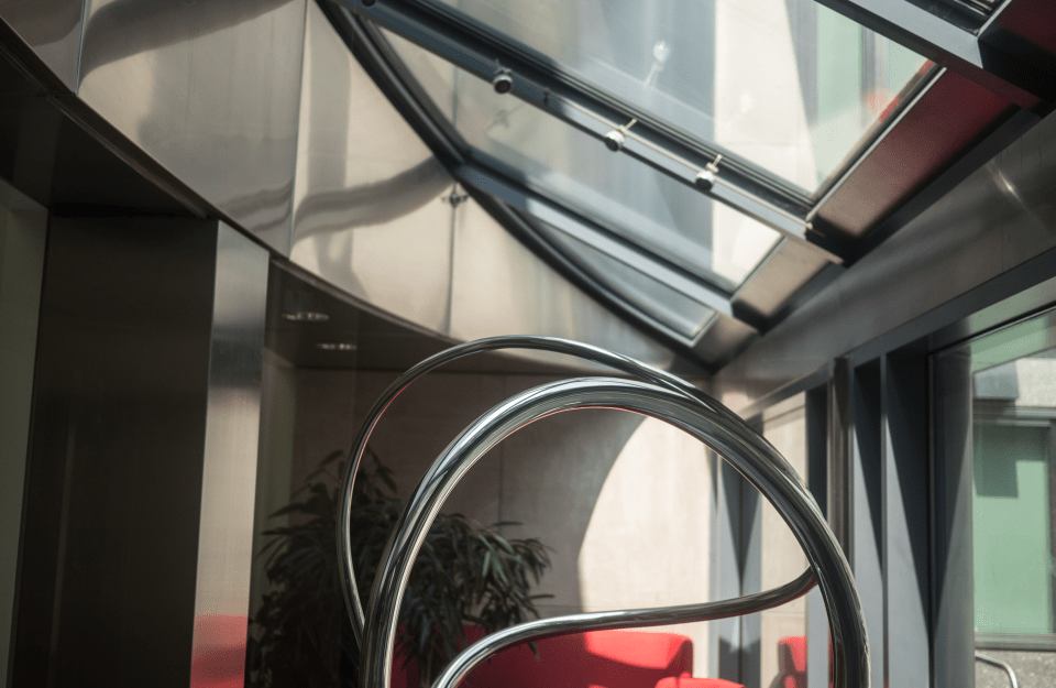 closeup of a portion of metal sculpture in Annenberg front lobby on a sunny day