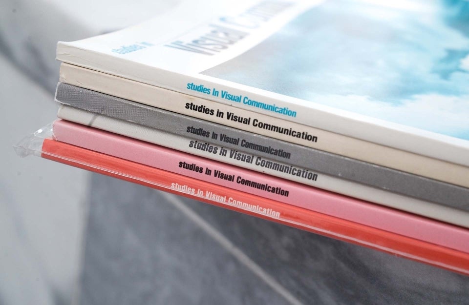 Photo of a stack of "Studies in Visual Communication" books