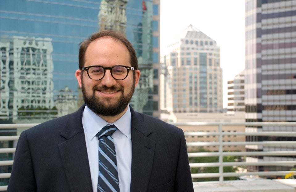 Seth Grossman in suit and tie, smiling