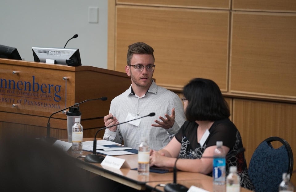 Tyler Leigh moderating a panel discussion