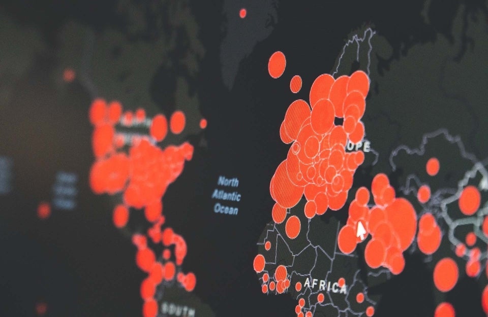 Data points on a map of the world; photo credit: Martin Sanchez / Unsplash