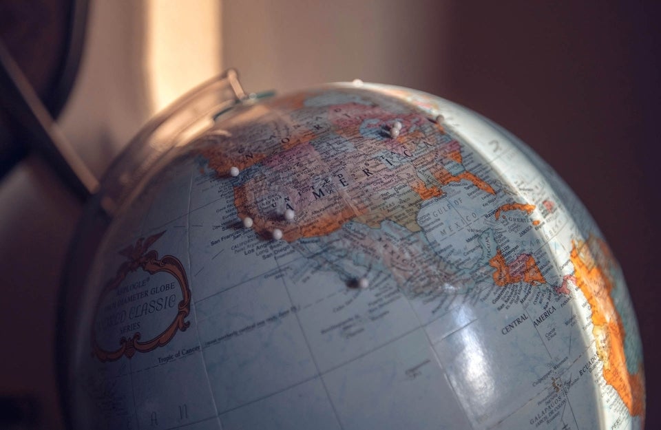 Close-up shot of a globe. photo credit Nicole Geri / Unsplash