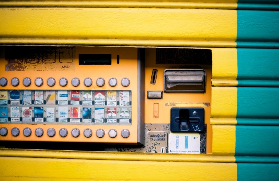 bright yellow-blue cigarette machine, photo credit Francesco Paggiaro / Pexels