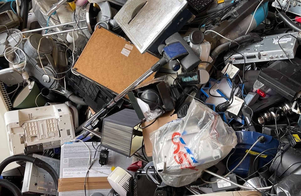 large pile of e-waste; Photo Credit: John Cameron on Unsplash