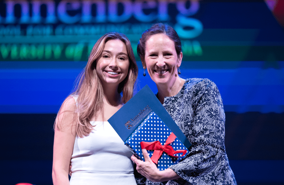 Associate Dean for Undergraduate Studies Litty Paxton presents an award to Celia Kreth (C’23).