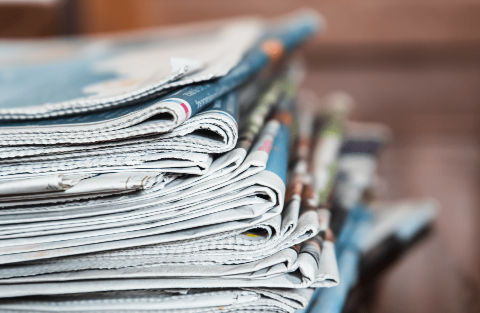 A pile of stacked newspapers