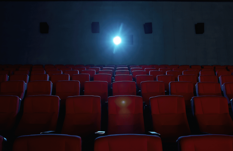 Empty movie theater with red seats