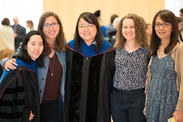 From left to right, Ph.D. Graduate Stella (Juhyun) Lee; Doctoral Student Allyson Volinsky; Ph.D. Graduate Jiaying Liu; Doctoral Student Elissa Kranzler; and Annenberg Library Assistant Min Zhong posing for the picture. They are all smiling.