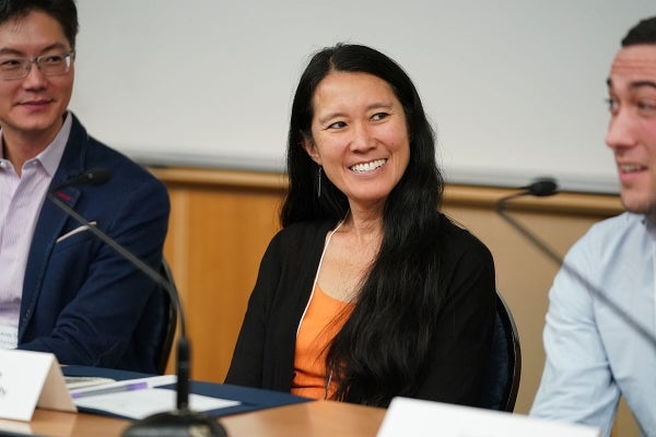 Bessie Lee Lawton who is smiling to her left as a fellow presenter speaks