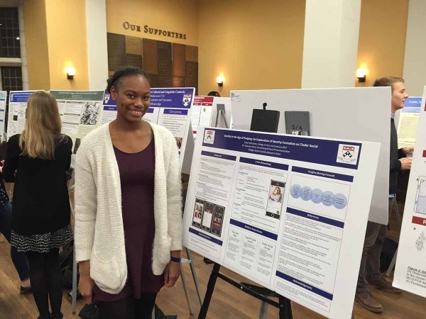 Jaslyn McIntosh poses with her thesis project