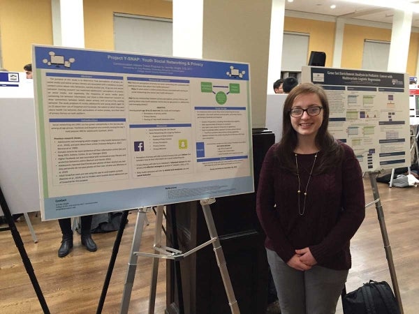 Jennifer Wright poses in front of her thesis research