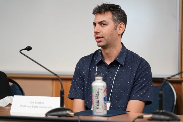 Lee Shaker seated and speaking