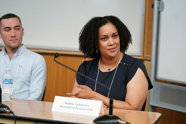 Nadine Gabbadon seated and speaking towards the left