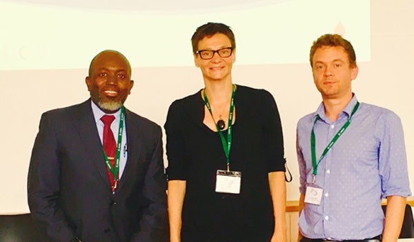 From left to right, Roger Caruth, Tonny Krijnen and Noam Tirosh stand beside each other and smile for the photo