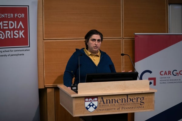 Wazhmah Osman speaks at a podium