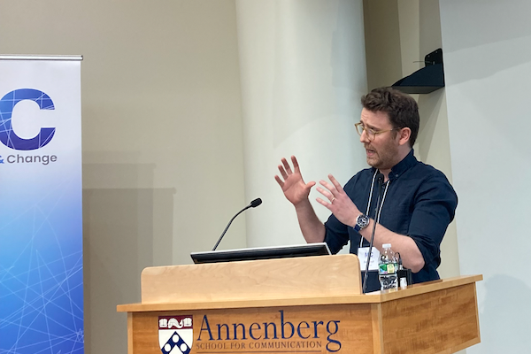 Ben Tarnoff speaks at a podium