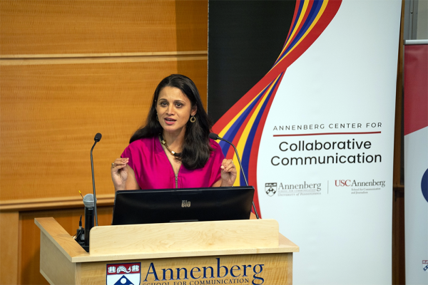 Srila Roy speaks at a podium