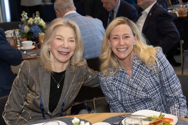 Left: Gutmann (left) with Maurie D. McInnis, president of Yale University.