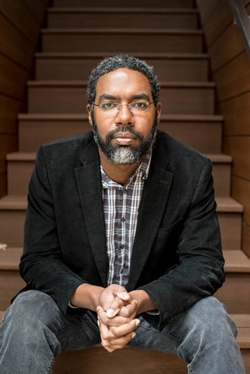 Deen Freelon seated on some stairs